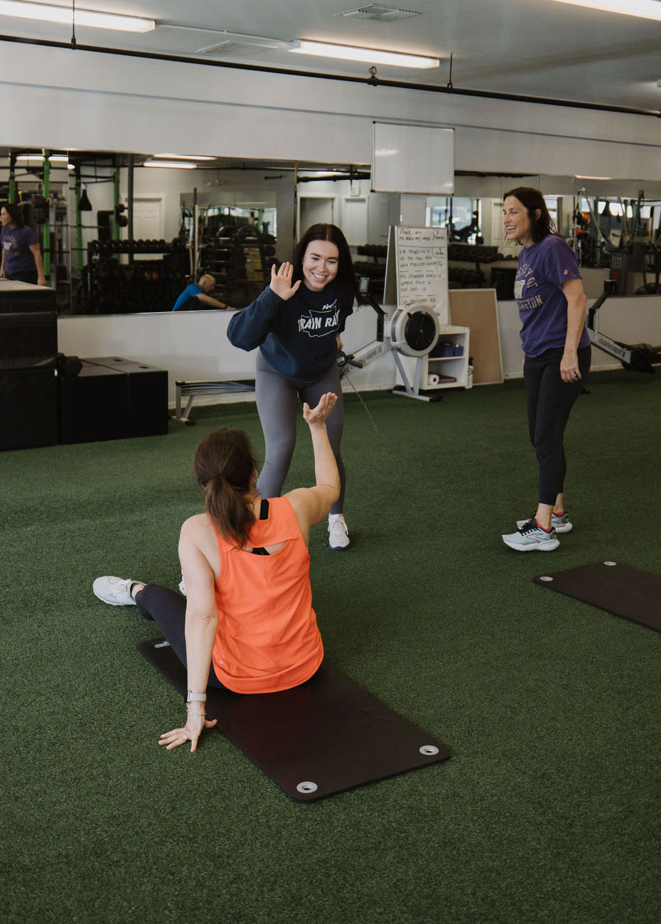 Small group celebrating during a semi-private training session at Innovative Fitness